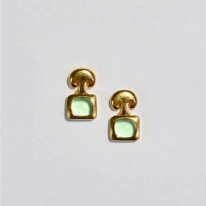 Gold Etruscan style earrings with light green glass cabochons. Stamped MMA.